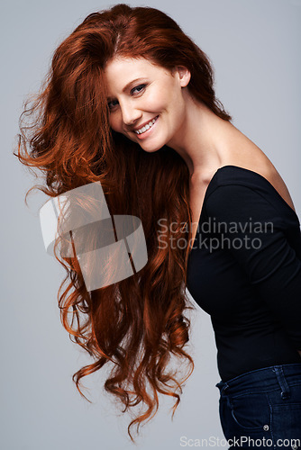 Image of Hair care, portrait of happy red head woman and wellness in background. Beauty salon or hairstyle, cosmetic treatment and female model with natural shine in studio backdrop to promote self love