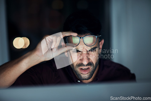 Image of Night, confused businessman work in glasses and shock, angry or frustrated with screen, online communication or 404 error. Man, face and reading eyewear or late working with stress, computer and fail