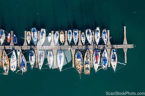 Image of Landscape, port and drone of boats on the water for travel, sailing and holiday in Spain. Environment, marine and above of sea transportation at a harbor for vacation, cruise and traveling adventure