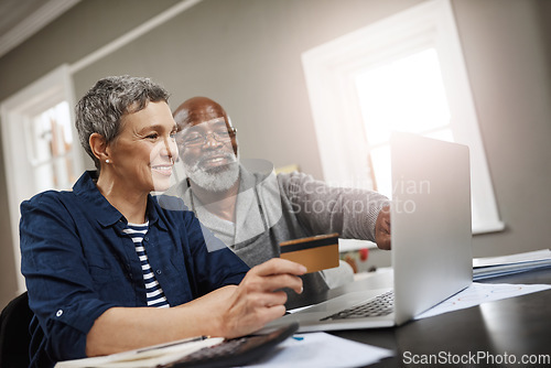 Image of Credit card, laptop and senior couple for online shopping, ecommerce and fintech payment for home insurance. Finance, pension or financial investment of biracial woman and partner on computer banking