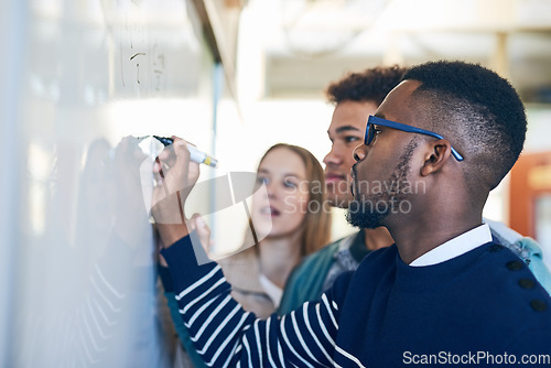 Image of Diversity, students writing on whiteboard and in classroom of school building. Problem solving or formula, brainstorming or presentation and people write on board in class of college or university