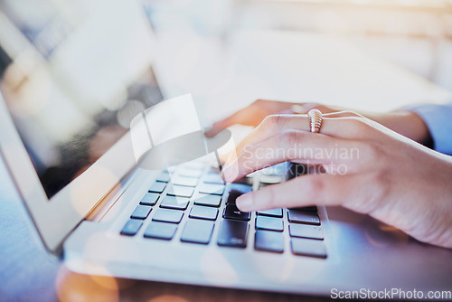 Image of Hands, laptop and keyboard with person typing or writing article on computer or on the internet for research. Copywriting, seo and employee on the web or technology with pc on digital connection