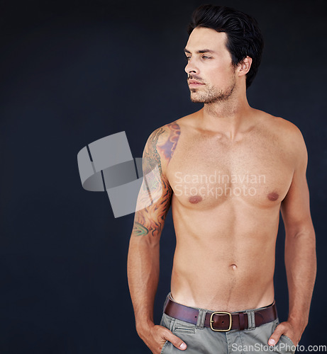 Image of Thinking, mockup and shirtless with a sexy man in studio on a dark background for masculine desire. Idea, tattoo and aesthetic with a handsome young male model posing topless for manly sensuality