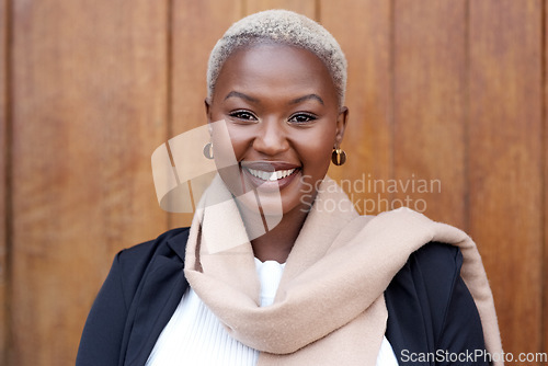Image of Fashion, face and portrait of a black woman with a smile, happiness and positive mindset. Headshot of a happy female model person against a wooden wall outdoor in city for travel, business and beauty
