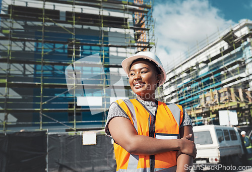 Image of Engineer, construction and a black woman thinking outdoor at building site for development and architecture. Female contractor happy for project management, engineering and equal opportunity in city