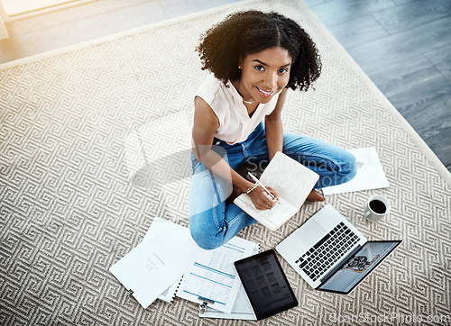 Image of Laptop, notebook and woman on floor for work from home opportunity, financial planning and writing ideas from above. African person on computer, brainstorming and budget documents for happy startup