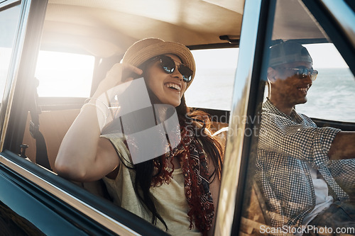 Image of Happy couple, together and on a road trip in a car for freedom, travel and holiday. Smile, relax and a young man and woman in transportation driving for a vacation, date or an adventure in summer