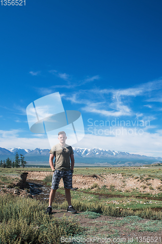 Image of Relaxing man in Kurai steppe on North-Chui ridge