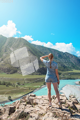 Image of Woman taking selfie on mobile phone