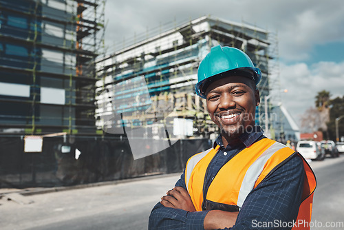 Image of Construction, engineer and happy portrait of a black man outdoor at building site for development and architecture. Male contractor smile for project management, engineering and safety inspection