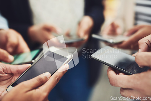 Image of Business people, phone and hands for communication, networking or social media together at office. Hand of group holding mobile smartphone in connection, data sync or sharing information at workplace