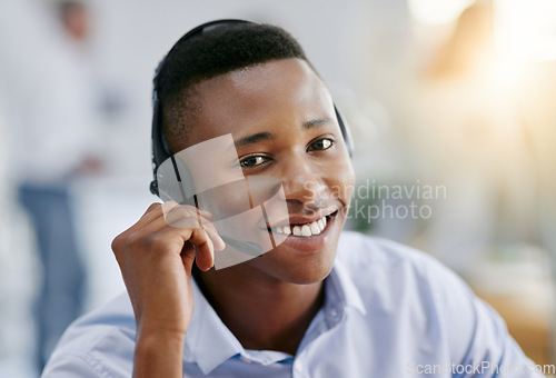 Image of Communication, portrait or friendly black man in call center consulting or talking at customer services. Virtual assistant, happy smile or face of sales agent in telemarketing or telecom company