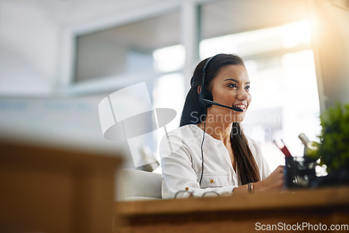 Image of Customer service, virtual assistant or happy woman in call center consulting, speaking or talking at help desk. Contact us, friendly agent or sales consultant in telemarketing or telecom company