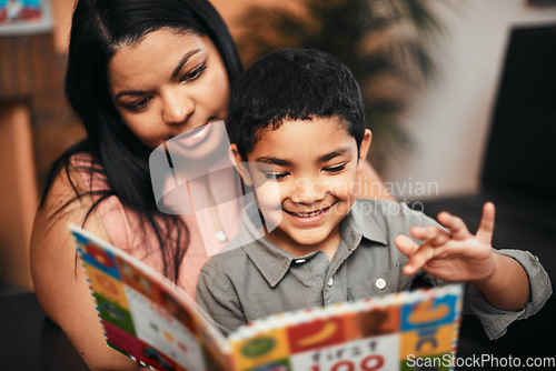 Image of Mother, son and happy with book, learning and reading together with support, care and love in family home. Woman, boy child and teaching for education, development and life skills in house with story