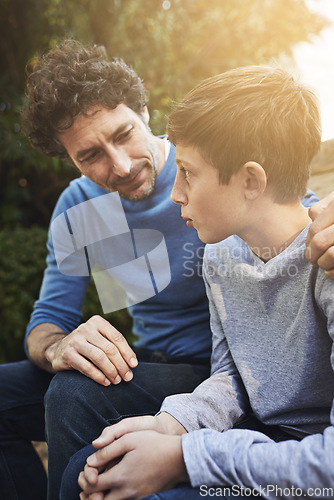 Image of Family, father and son have conversation in backyard, bonding with love and care, communication and relationship. Man help by giving teen boy advice at home, outdoor together with trust and support