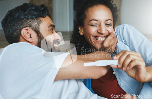 Image of Happy couple, excited and smile for pregnancy test together for happiness, laughing and excitement. Love, funny and a man and pregnant woman looking excited and reading results for a baby at home