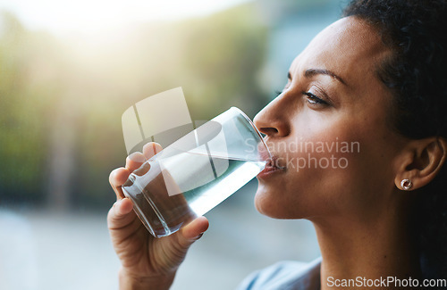 Image of Health, glass and woman drinking water, wellness and nutrition at home, happiness and refreshment. Female person, happy and lady with clear liquid, natural and care with a smile, fresh and hydration