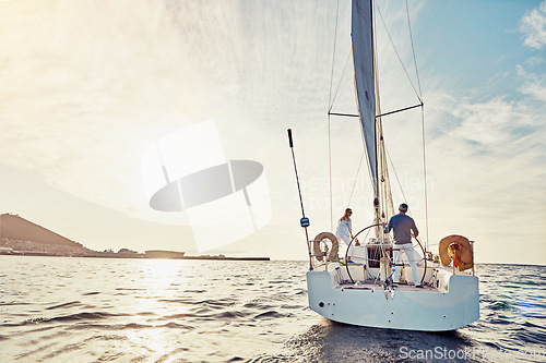 Image of Couple, yacht or sailing on vacation for adventure at sea with sun and waves to relax in summer. Ocean, people or cruise together for holiday on water for travel and sunshine for retirement lifestyle