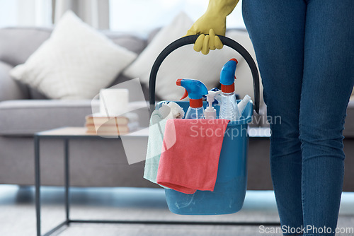 Image of Chores, product and hands with a bucket for cleaning, cleaner lifestyle and home routine. Housework, apartment and person holding equipment to clean a house for housekeeping and hygiene in the lounge