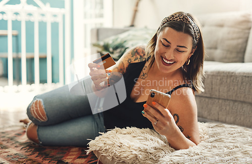 Image of Phone, credit card and woman on floor for online shopping, e commerce and fintech payment, loan or finance at home. Happy person relax on carpet, typing and internet banking on mobile app transaction