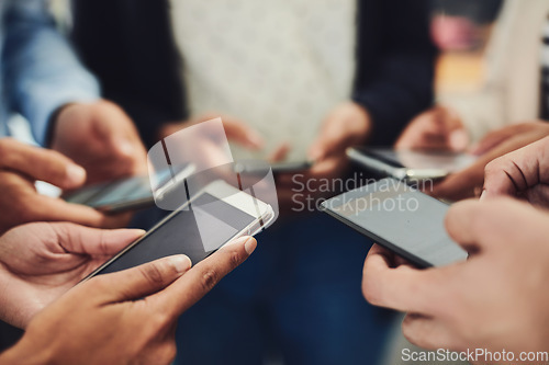 Image of Business people, phone and hands in networking, social media or data sync together at office. Hand of group holding mobile smartphone for connection, communication or sharing information at workplace