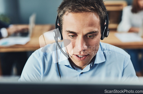 Image of Businessman, call center and consulting with headphones on computer in customer service, support or telemarketing at office. Man consultant agent talking on PC for online advice or help in contact us