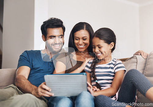 Image of Relax, smile and family on a sofa, tablet and bonding at home, connection and streaming a movie. Parents, mother and father on a couch, games and female child in the living room with cartoon film