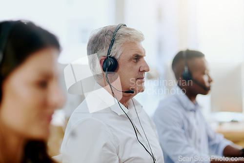 Image of Virtual assistant, consultant or senior man typing in call center consulting at customer services help desk. Contact us, blurry or mature sales agent in telemarketing, crm or online telecom company
