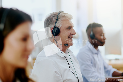 Image of Virtual assistant, happy or senior man typing in call center consulting at customer services help desk. Contact us, blurry or friendly mature sales agent in telemarketing or online telecom company