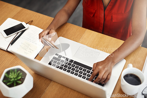 Image of Business woman, laptop and paying with credit card for online shopping, e-commerce or internet store. Hands of a female entrepreneur at desk for banking, booking or fintech payment on a website