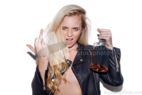 Image of Alcohol, portrait and rude woman with middle finger gesture, symbol or emoji icon for drunk rebel. Whiskey bottle, studio face and angry person with vodka, tequila or whisky drink on white background