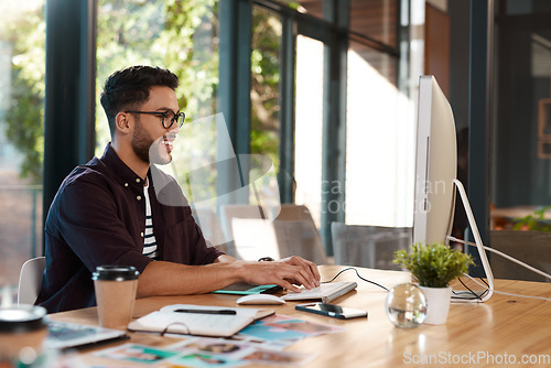 Image of Office, designer and man typing on computer at desk while online for search or creative work. Happy male entrepreneur person with internet connection and glasses for design project or writing email