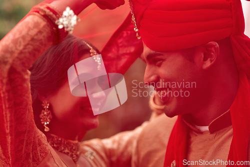 Image of Wedding, romance and red veil with a couple together in celebration of love at a ceremony. Happy, marriage or islam with a hindu bride and groom getting married outdoor in tradition of their culture