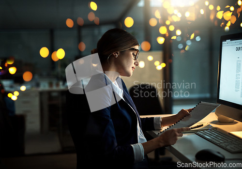 Image of Night, notes or business woman reading research or paperwork overtime working on digital strategy. Late, lens flare or focused employee with portfolio file for project deadline on internet in office