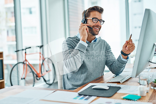 Image of Call center, man and consultant consulting with a smile doing internet telemarketing sales in an agency office. Young, computer and happy male employee working on customer service for support