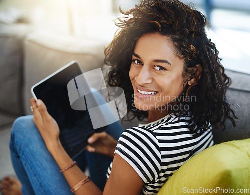 Image of Happy, tablet and portrait of woman on sofa in home for network, online website and social media. Communication, relax and African female person on digital tech for videos, streaming and internet