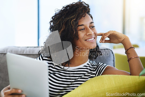 Image of Tablet, thinking and woman on sofa in home for network, online website and social media app. Communication, connection and happy African female person on digital tech for relax, contact and internet