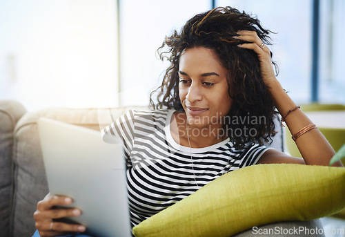 Image of Relax, tablet and woman on sofa in home for network, online website and social media. Communication, mobile app and African female person on digital tech for streaming, videos and internet connection