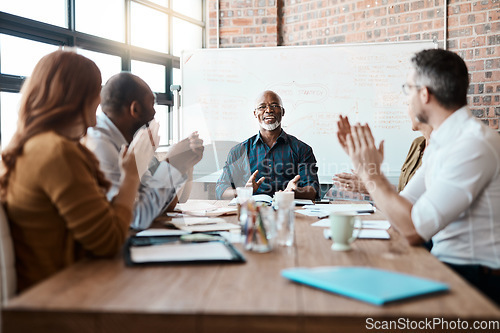 Image of Business people, meeting and applause of black man in office for achievement, goal or target. Excited, clapping and senior African male professional with group of employees in celebration of success.