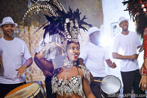 Image of Celebration, dance and exotic female dancer performing with a band at mardi gras or cultural festival. Performance, costume and woman dancing with rhythm to live music at a carnival in Rio de janeiro