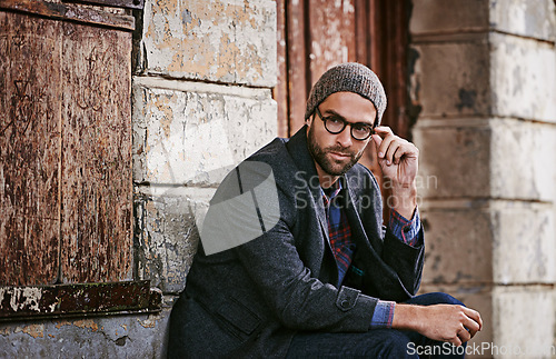 Image of Thinking, fashion and man outdoor, winter and relax with trendy clothes, eyewear and thoughtful. Male person, model or guy with glasses, wonder or ideas with stylish outfit, relax or ponder in a city