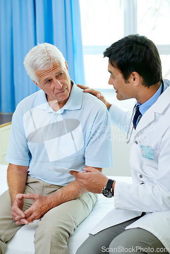 Image of Consultation, doctor and old man in hospital room with advice, help and support from senior care clinic. Retirement, discussion on results and elderly patient sitting on bed with medical professional