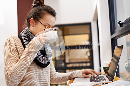 Image of Remote work, woman drinking coffee and laptop for freelance writer at cafe store. Social media or networking, reading emails and female student or content creator on mobile device in restaurant