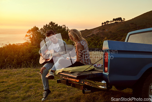 Image of Sunset, truck or couple with guitar in nature on romantic holiday vacation for bonding or relaxing on date. Car road trip, travel or people playing music in summer with romance in park field together