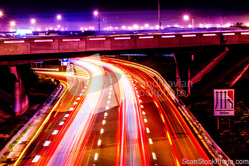 Image of Night lights, city and highway with driving infrastructure in cape town with road travel development. Transportation, neon lighting and urban street in the evening and dark in Africa rush and blur