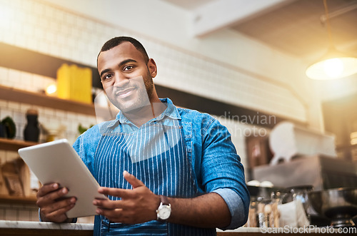 Image of Smile, tablet and portrait of man in cafe for online, entrepreneurship and startup. Retail, technology and food industry with small business owner in restaurant for barista, store and coffee shop