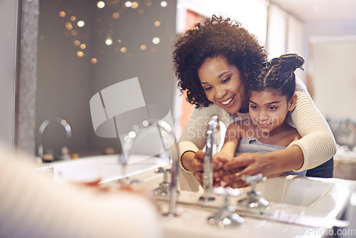 Image of Water, cleaning and washing hands by mother and child in a bathroom for learning, hygiene and care. Basin, wash and hand protection by mom and girl together for prevention of bacteria, dirt and germs