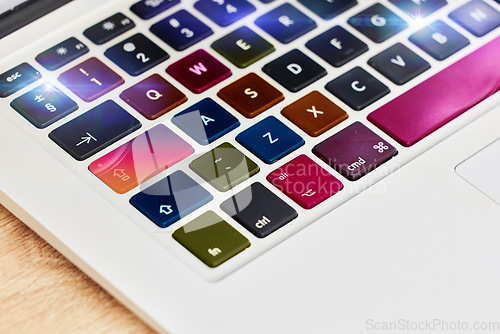 Image of Laptop keyboard, color and technology for work, business and internet on a table. Digital, creative and pc computer for electronic entertainment, gaming or web on a desk for streaming and creativity