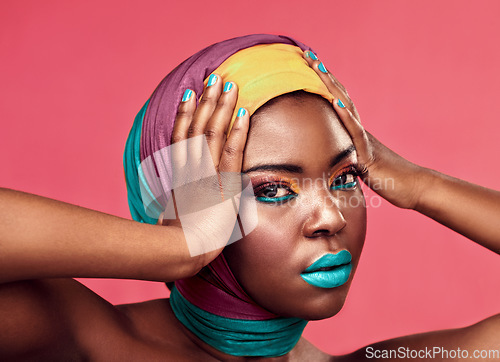 Image of Makeup, beauty and scarf with portrait of black woman in studio for creative, art and culture. Fashion, cosmetics and natural with face of model isolated on pink background for african and color