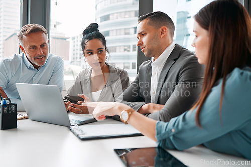 Image of Laptop, business meeting and team discussion for presentation analysis, training and sales marketing in modern office. Teamwork, corporate conversation and planning web strategy with tech device